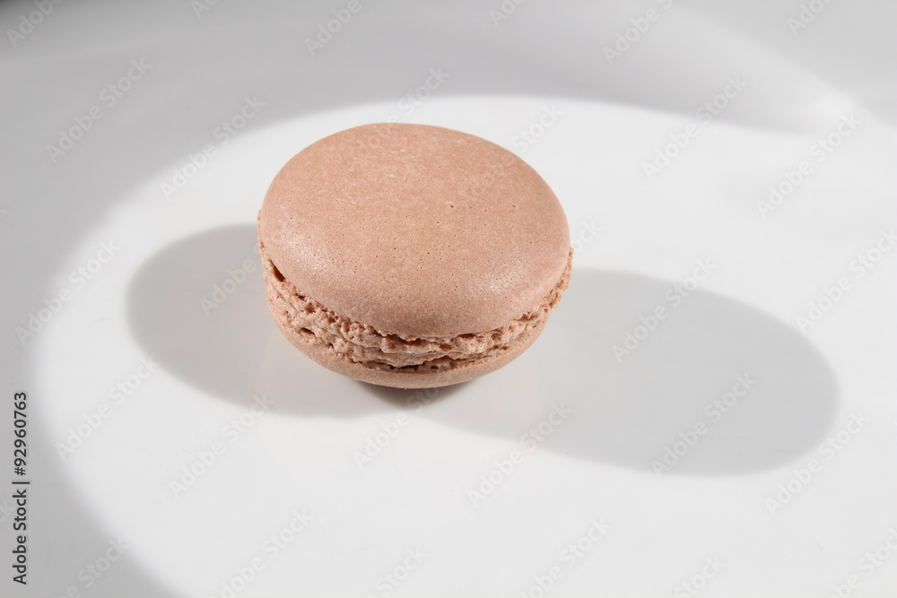 French brown macarons on hell background French brown macarons on hell background