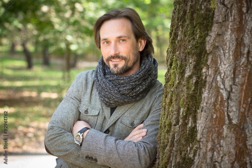 Portrait of handsome middle-aged man in the park Portrait of handsome middle-aged man in the park
