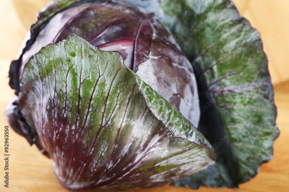 Obraz premium Red cabbage on wooden table, close-up