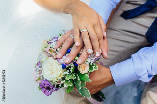 Hands of the bride and groom.