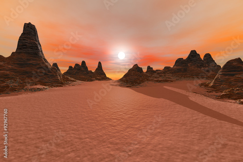 Desert, a rocky landscape, sunset and a beautiful sky.