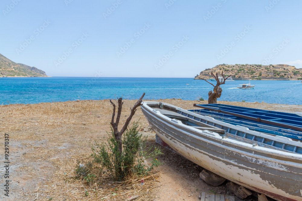 Fishing Boat on Spinaloga beach Crete, Greece Fishing Boat on Spinaloga beach Crete, Greece