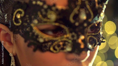 Venetian masquerade. Sexy woman wearing masquerade mask photo