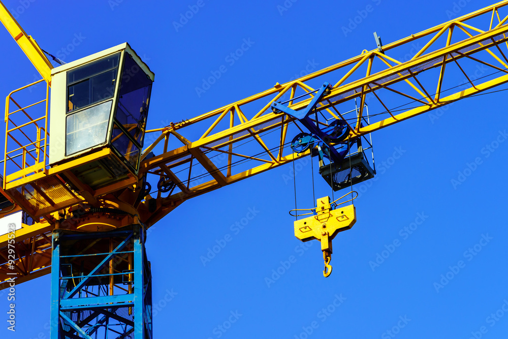 Crane and building construction site against the sky Crane and building construction site against the sky
