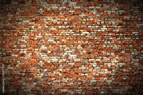Background of red, tiny bricks texture. Vignette.