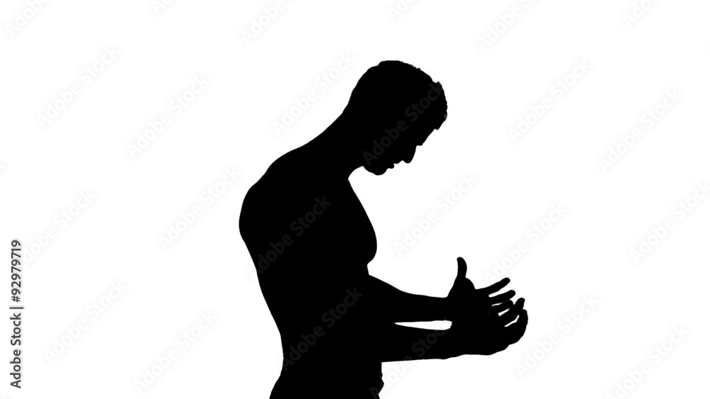 Muscular silhouette of man flexing muscles Muscular silhouette of man flexing muscles