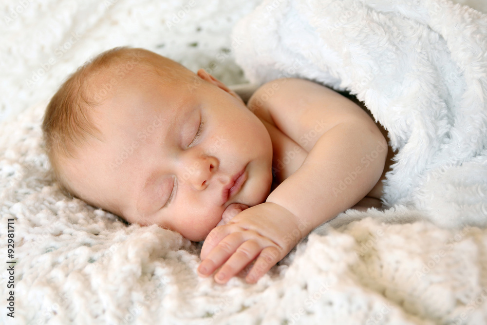 Sweet Newborn Infant Girl Sleeping in White Blankets Sweet Newborn Infant Girl Sleeping in White Blankets