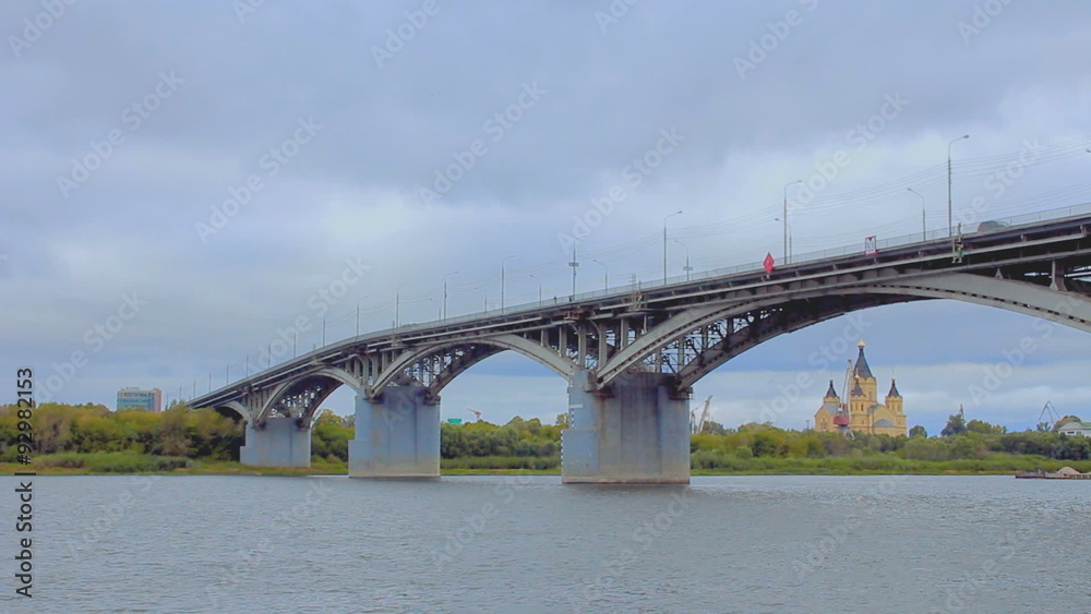 The barge passes under the bridge Kanavinsky over Oka river The barge passes under the bridge Kanavinsky over Oka river