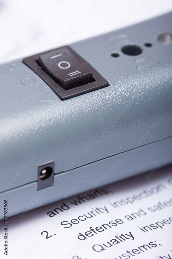 On off button on the plastic metal detector device On off button on the plastic metal detector device