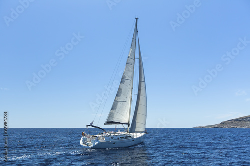 Sailing in the wind through the waves at the Aegean Sea. Luxury yachts. © De Visu