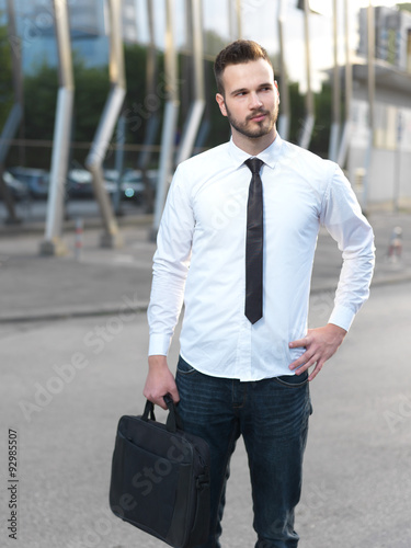 Friendly and smiling handsome businessman looking confidently 