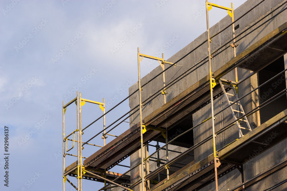 Wall of concrete building. Construction site works. Wall of concrete building. Construction site works.