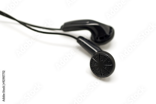 black audio earbuds isolated on white
