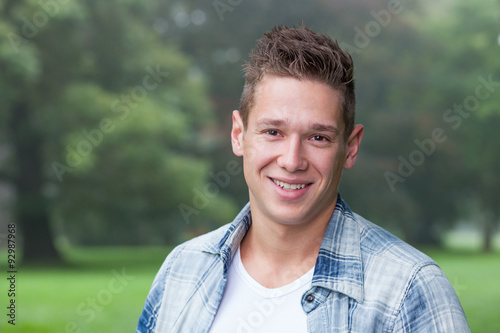 portrait of young man in park