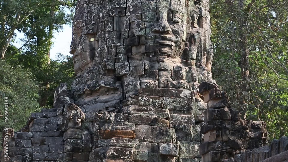Bas-relief of the face on the ancient wall in Angkor Thom temple complex, Cambodia Bas-relief of the face on the ancient wall in Angkor Thom temple complex, Cambodia