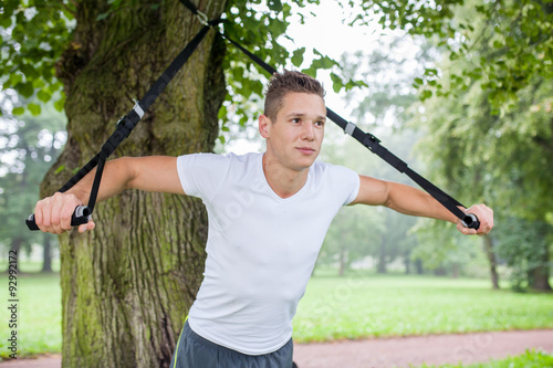 practice with sling trainer in park