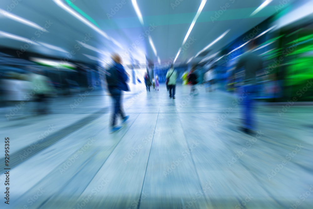 Crowd of anonymous people walking on busy city street