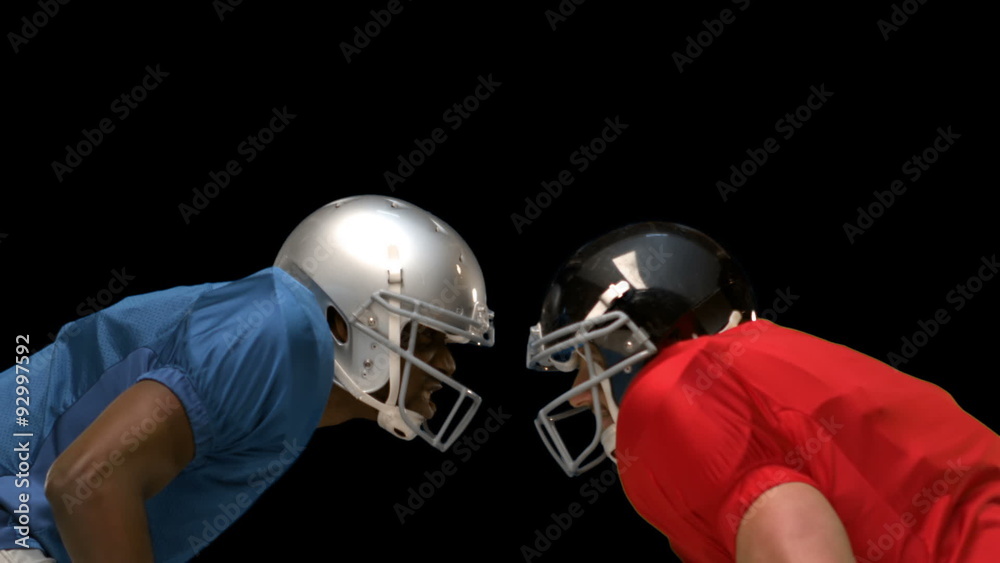 Serious american football player looking at each other Serious american football player looking at each other