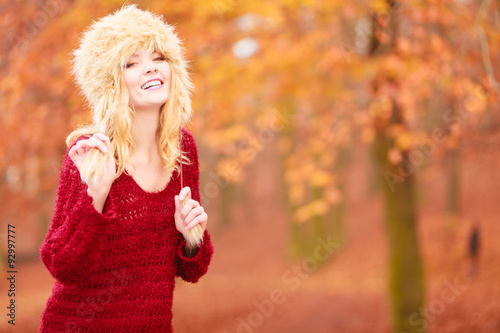 Portrait of pretty smiling woman in fur winter hat