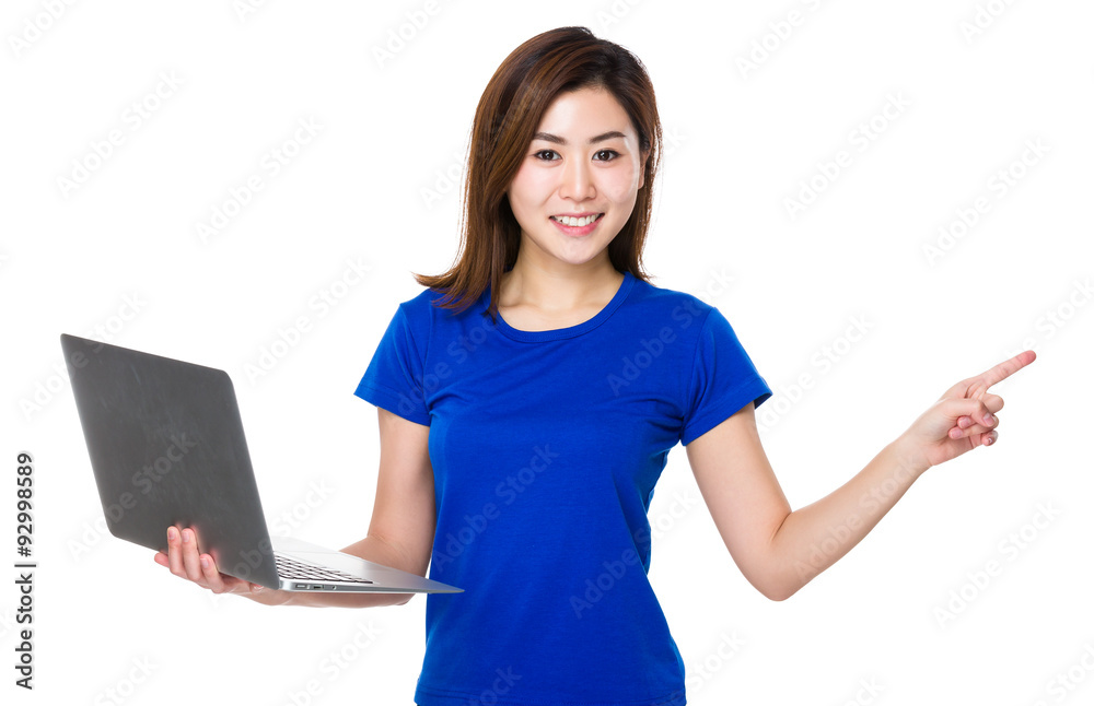 Woman hold with laptop computer and finger point aside Woman hold with laptop computer and finger point aside
