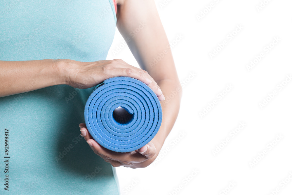 Young woman holding a yoga mat, on white background Young woman holding a yoga mat, on white background