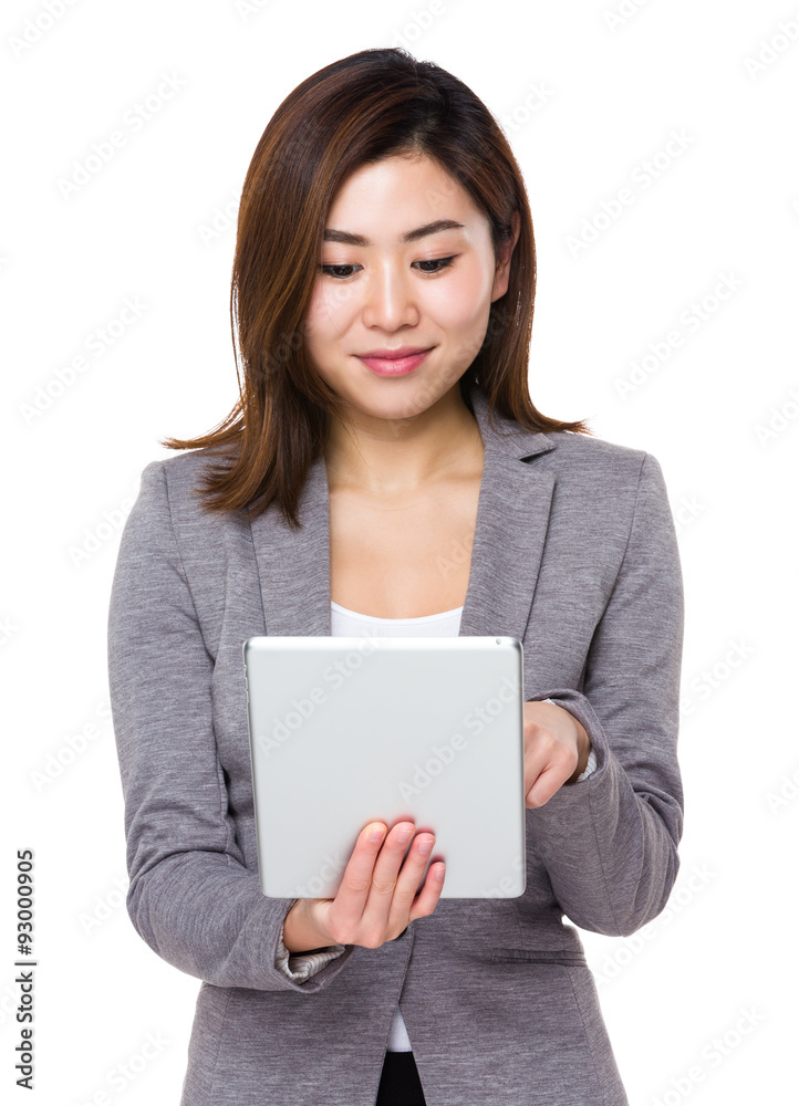 Asian Young businesswoman use of the tablet pc Asian Young businesswoman use of the tablet pc