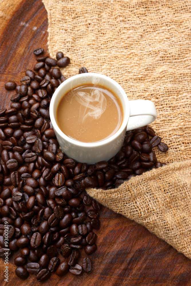 Coffee and beans on the wooden background. Coffee and beans on the wooden background.