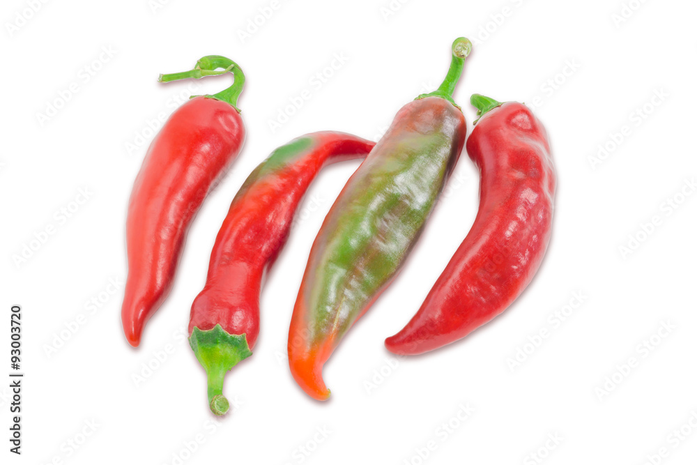 Several red and green peppers chili on a light background