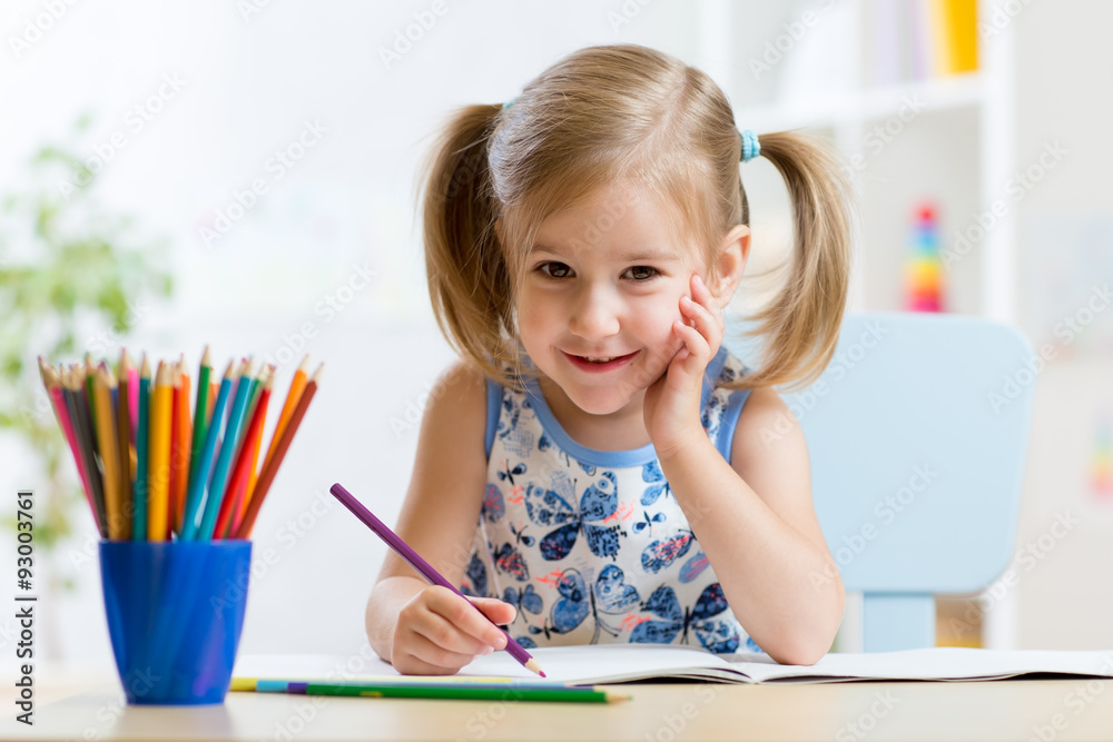 Cute little preschooler child drawing at home Cute little preschooler child drawing at home