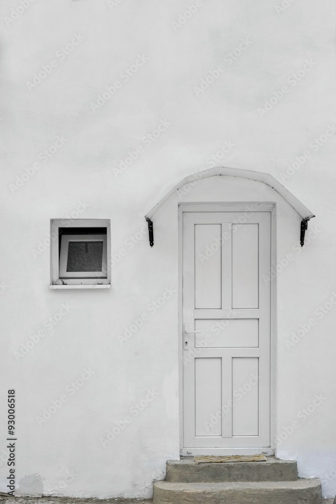 Old Whitewashed House Facade With Small White Window And Door Old Whitewashed House Facade With Small White Window And Door