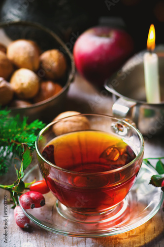 cup of briar tea on a Christmas rustic background.