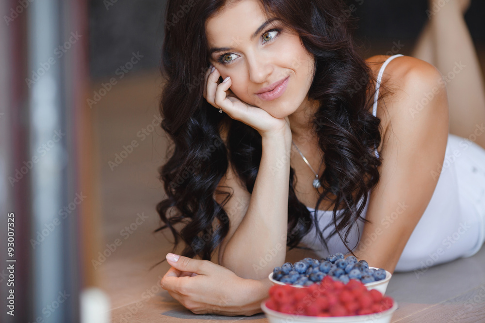 Home portrait of a happy woman with ripe berries Home portrait of a happy woman with ripe berries