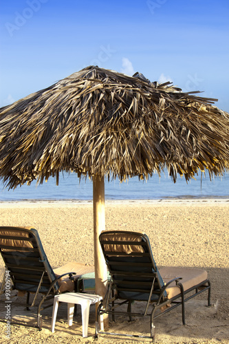 Umbrella and chaise lounges on a beach