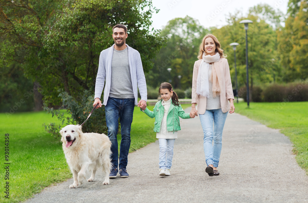 happy family with labrador retriever dog in park happy family with labrador retriever dog in park