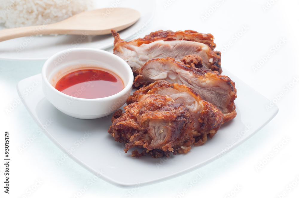 Chicken and spicy sauce on the plate and white background, food Chicken and spicy sauce on the plate and white background, food