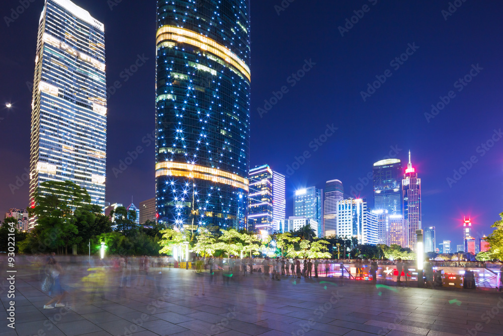 modern square and skyscrapers at night