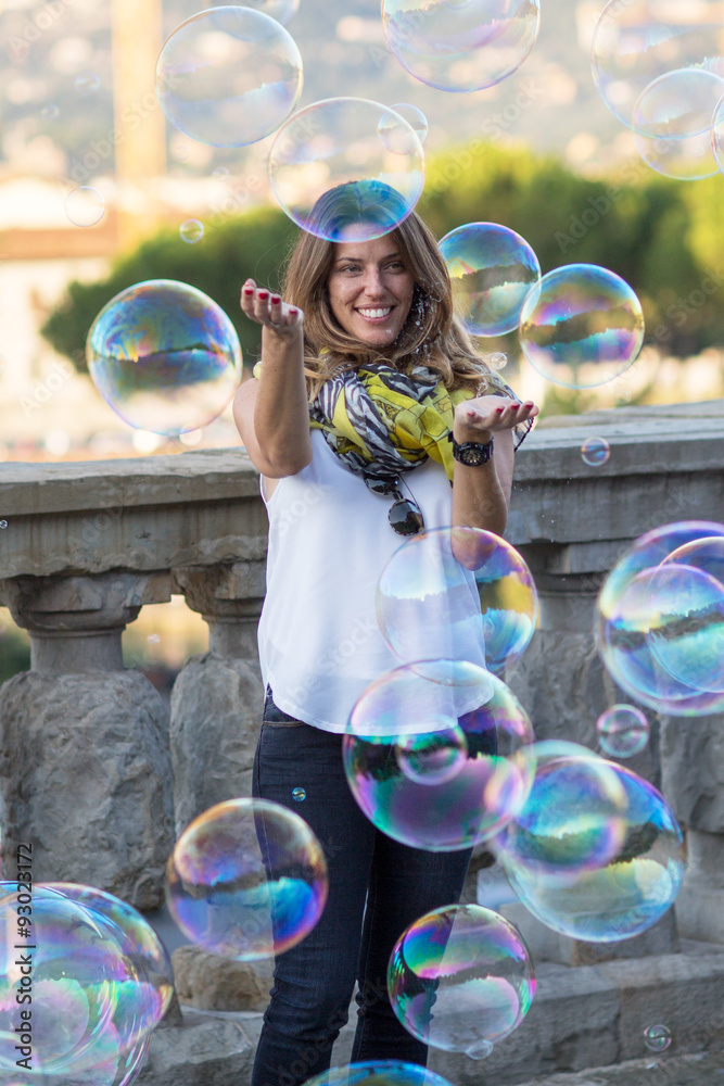 Blonde middle aged woman playing with bubble Blonde middle aged woman playing with bubble