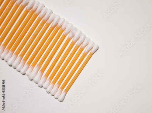 Cotton bud on white paper