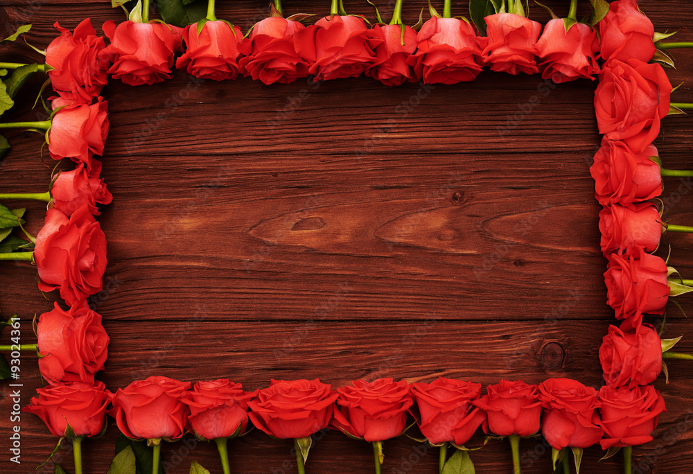red roses with empty wooden copyspace
