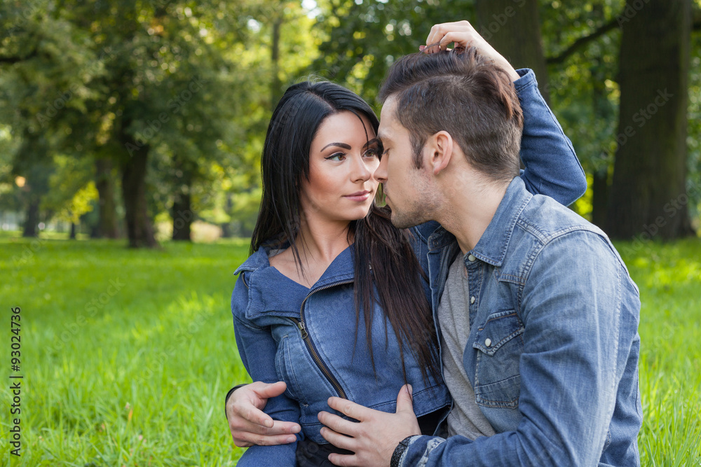 Fototapeta premium young couple in intimate moments in the park