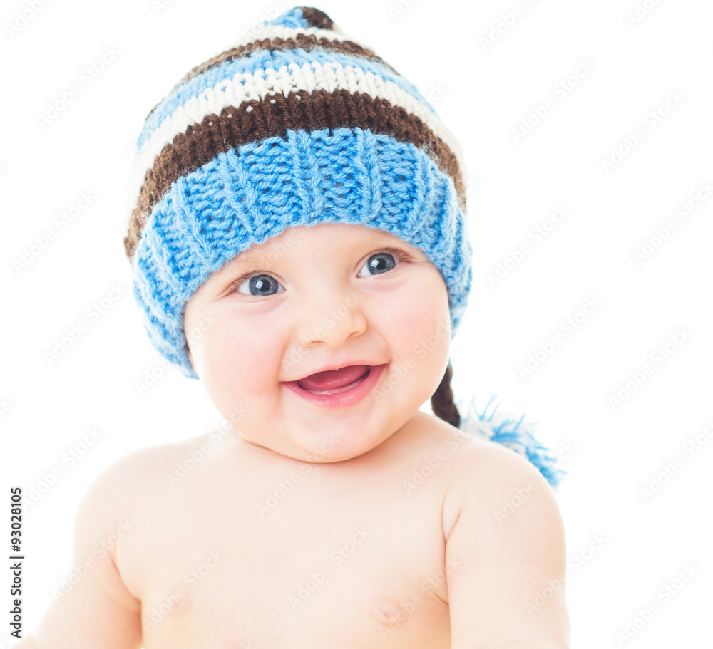 cheerful baby in the blue hat. Beautiful happy baby . One,isolat cheerful baby in the blue hat. Beautiful happy baby . One,isolat