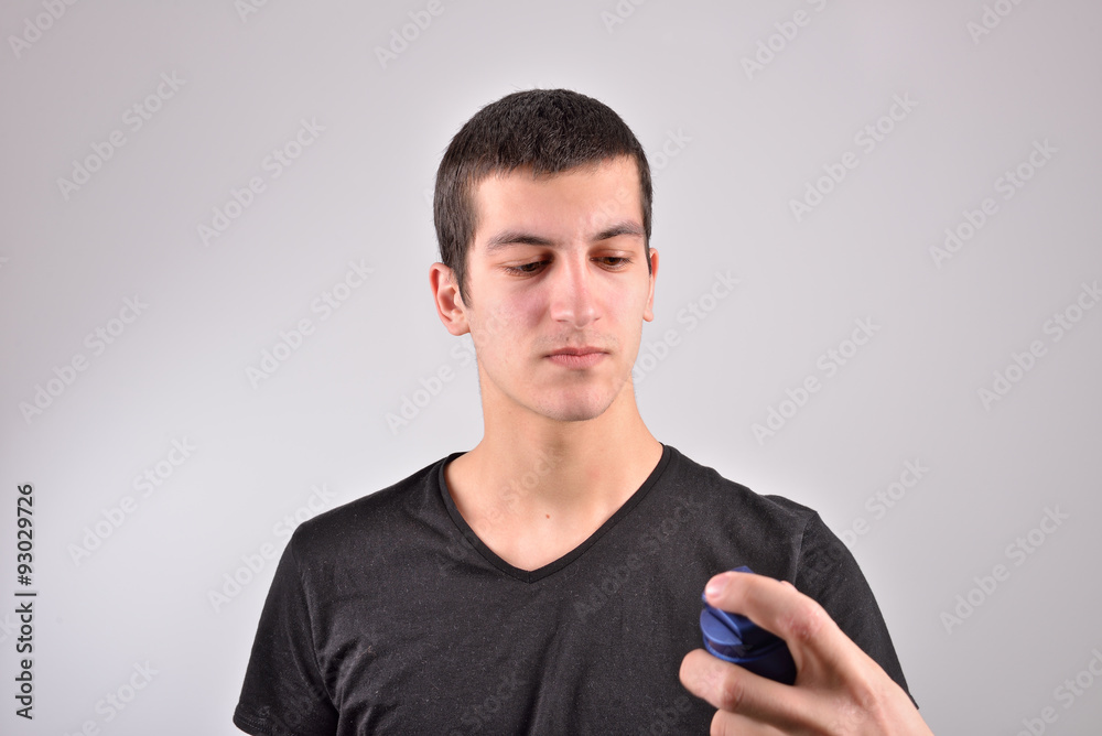 Young man with shaving foam on the palm preparing to shave, look Young man with shaving foam on the palm preparing to shave, look