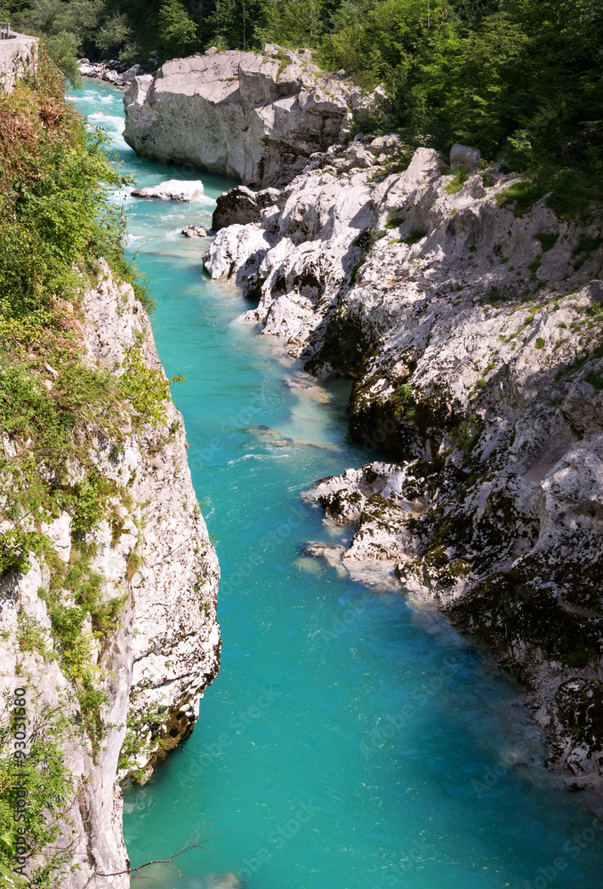 Emerald Soca river running between rocks near Kobarid Emerald Soca river running between rocks near Kobarid