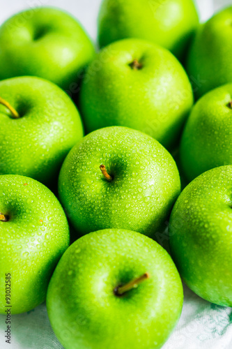 Bright green apples on white napkin