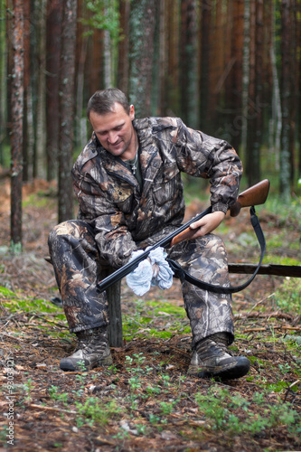 hunter cleaning shotgun