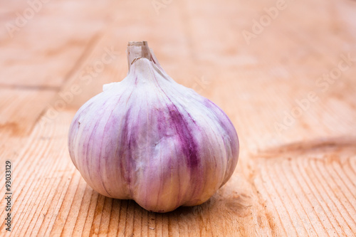 head of garlic on wooden table