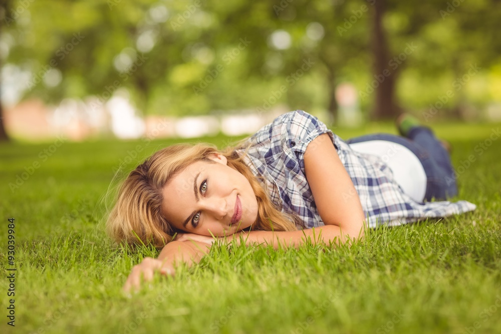 Portrait of cheerful woman lying on front Portrait of cheerful woman lying on front