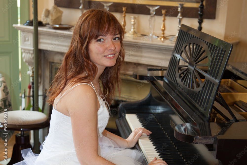 Young beautiful bride playing the grand piano Young beautiful bride playing the grand piano