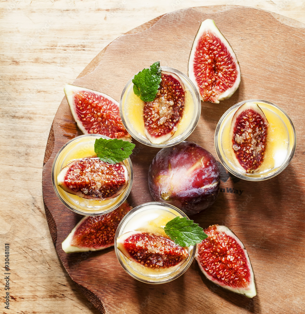 Creamy white yogurt with honey, figs and mint, top view, selecti Creamy white yogurt with honey, figs and mint, top view, selecti