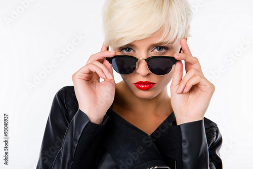 confident young woman with red lips and glasses